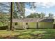 Expansive backyard featuring a deck, lush greenery, and mature trees, perfect for outdoor activities at 4954 Browns Mill Rd, Lithonia, GA 30038