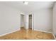 This bright bedroom features hardwood floors and a closet for ample storage at 4954 Browns Mill Rd, Lithonia, GA 30038