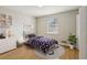 Charming bedroom with natural light, hardwood floors, and playful decor for a cozy atmosphere at 4954 Browns Mill Rd, Lithonia, GA 30038