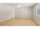 Bedroom featuring hardwood flooring and natural lighting from window at 4954 Browns Mill Rd, Lithonia, GA 30038