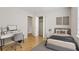 Bedroom boasts wood floors, closet, and a desk area, perfect for relaxation and productivity at 4954 Browns Mill Rd, Lithonia, GA 30038