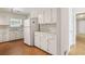 Functional kitchen featuring white cabinets and appliances at 4954 Browns Mill Rd, Lithonia, GA 30038