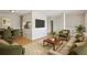Inviting living room featuring hardwood floors and a seamless transition to the dining area at 4954 Browns Mill Rd, Lithonia, GA 30038