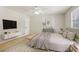 Bright main bedroom featuring modern decor, ceiling fan and natural light at 4954 Browns Mill Rd, Lithonia, GA 30038