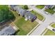 An aerial view of a home with a large yard, driveway, and rear deck in a residential neighborhood at 6330 Shell Sw Dr, Atlanta, GA 30331