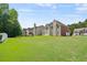 Expansive backyard with lush green lawn, ideal for outdoor activities and relaxation at 6330 Shell Sw Dr, Atlanta, GA 30331