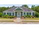 Exterior view of the community clubhouse with neat landscaping, accessible parking, and a welcoming entrance at 6330 Shell Sw Dr, Atlanta, GA 30331