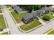 Aerial view showcasing a two-story brick home with lush landscaping and a paved driveway at 6330 Shell Sw Dr, Atlanta, GA 30331