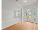 Inviting foyer with a decorative glass front door and gleaming hardwood floors at 6330 Shell Sw Dr, Atlanta, GA 30331