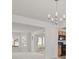 Bright living area with a chandelier, white walls, and access to the kitchen at 6330 Shell Sw Dr, Atlanta, GA 30331