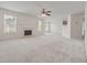 Open-concept living room with a fireplace and a ceiling fan at 6330 Shell Sw Dr, Atlanta, GA 30331