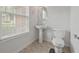 Powder room with updated pedestal sink and fixtures at 6330 Shell Sw Dr, Atlanta, GA 30331