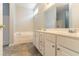 Bright primary bathroom featuring double vanity, a soaking tub and neutral paint at 7161 Boulder Pass, Union City, GA 30291