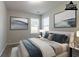 This bedroom features neutral walls, soft carpet, stylish decor, and two windows for natural light at 7161 Boulder Pass, Union City, GA 30291