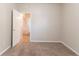 This bedroom features neutral walls, soft carpet, and an open doorway to the rest of the house at 7161 Boulder Pass, Union City, GA 30291