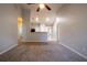 Open-concept living space with neutral walls, offering a versatile layout and seamless flow to other rooms at 7161 Boulder Pass, Union City, GA 30291