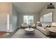 Virtually staged living room with high ceilings, plush carpet, and a bright window at 7161 Boulder Pass, Union City, GA 30291