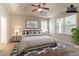 Virtually staged primary bedroom featuring a bed, nightstands, rug, and modern decor at 7161 Boulder Pass, Union City, GA 30291