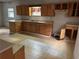Kitchen featuring wood cabinets, laminate countertops, and unique tile flooring at 1142 Pluma Se Dr, Atlanta, GA 30316