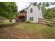 Backyard featuring a multi-level deck, lawn, and privacy fence at 1255 Hidden Creek Pt, Cumming, GA 30040