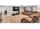 Spacious basement featuring a sectional sofa, entertainment center, and recessed lighting for a cozy gathering space at 1255 Hidden Creek Pt, Cumming, GA 30040
