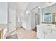 A well-lit bathroom offers double sinks with a shower and tub at 1255 Hidden Creek Pt, Cumming, GA 30040