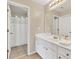 Bright bathroom with a double sink vanity, modern fixtures, and a separate shower stall for convenience at 1255 Hidden Creek Pt, Cumming, GA 30040