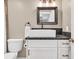 Modern bathroom showcasing a vessel sink, decorative mirror, and granite countertop for a luxurious feel at 1255 Hidden Creek Pt, Cumming, GA 30040