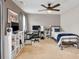 A comfortable bedroom offers a desk area and a ceiling fan at 1255 Hidden Creek Pt, Cumming, GA 30040
