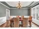 Inviting dining room featuring elegant trim, neutral paint, and hardwood floors at 1255 Hidden Creek Pt, Cumming, GA 30040