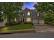 Charming two-story brick home with a well-manicured lawn and a two-car garage at 1255 Hidden Creek Pt, Cumming, GA 30040