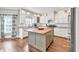 Bright eat-in kitchen featuring stainless appliances, center island with butcher block, and white cabinetry at 1255 Hidden Creek Pt, Cumming, GA 30040