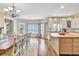 Open concept layout with bright kitchen and dining area at 1255 Hidden Creek Pt, Cumming, GA 30040