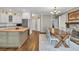 Open concept with bright kitchen and dining area at 1255 Hidden Creek Pt, Cumming, GA 30040