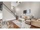Bright living room with soaring ceilings, hardwood floors, and a cozy fireplace at 1255 Hidden Creek Pt, Cumming, GA 30040