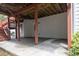Covered patio area beneath the deck, with room for outdoor seating and storage at 1255 Hidden Creek Pt, Cumming, GA 30040