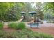Community playground with slides and play structures, perfect for Gathering fun and recreation at 1255 Hidden Creek Pt, Cumming, GA 30040