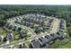 An aerial view of a new home community on a sunny day with partially wooded land at 1730 Fulmont Cir, Mableton, GA 30126