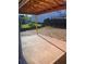 Backyard featuring a concrete patio, grassy area, and neighboring homes, creating a serene outdoor space at 1730 Fulmont Cir, Mableton, GA 30126
