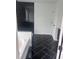 The bathroom features a black tiled shower with a bathtub to the left and a black tiled floor at 1730 Fulmont Cir, Mableton, GA 30126