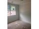 Empty bedroom with large window allowing for natural light and neutral paint at 1730 Fulmont Cir, Mableton, GA 30126