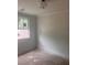 Bright bedroom with a large window and neutral paint at 1730 Fulmont Cir, Mableton, GA 30126