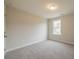 This bedroom features neutral walls, gray carpet, a window, and overhead lighting at 1730 Fulmont Cir, Mableton, GA 30126