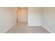 Carpeted bedroom with neutral paint, base trim, and a view to another room at 1730 Fulmont Cir, Mableton, GA 30126