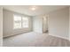 Carpeted bedroom with neutral paint and trim and a window view at 1730 Fulmont Cir, Mableton, GA 30126
