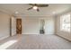 Bedroom with plush carpeting, ceiling fan and doors leading to bathroom and hallway at 1730 Fulmont Cir, Mableton, GA 30126