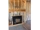 Close-up of an unfinished fireplace surrounded by framed walls and insulation, ready for finishing touches at 1730 Fulmont Cir, Mableton, GA 30126