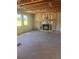 Unfinished room featuring a fireplace, insulation, and windows, highlighting the opportunity to create a cozy space at 1730 Fulmont Cir, Mableton, GA 30126