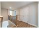 Upstairs landing with views of a bedroom and storage space at 1730 Fulmont Cir, Mableton, GA 30126