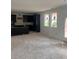 A spacious area showcasing modern dark cabinets and natural light from the windows at 1730 Fulmont Cir, Mableton, GA 30126